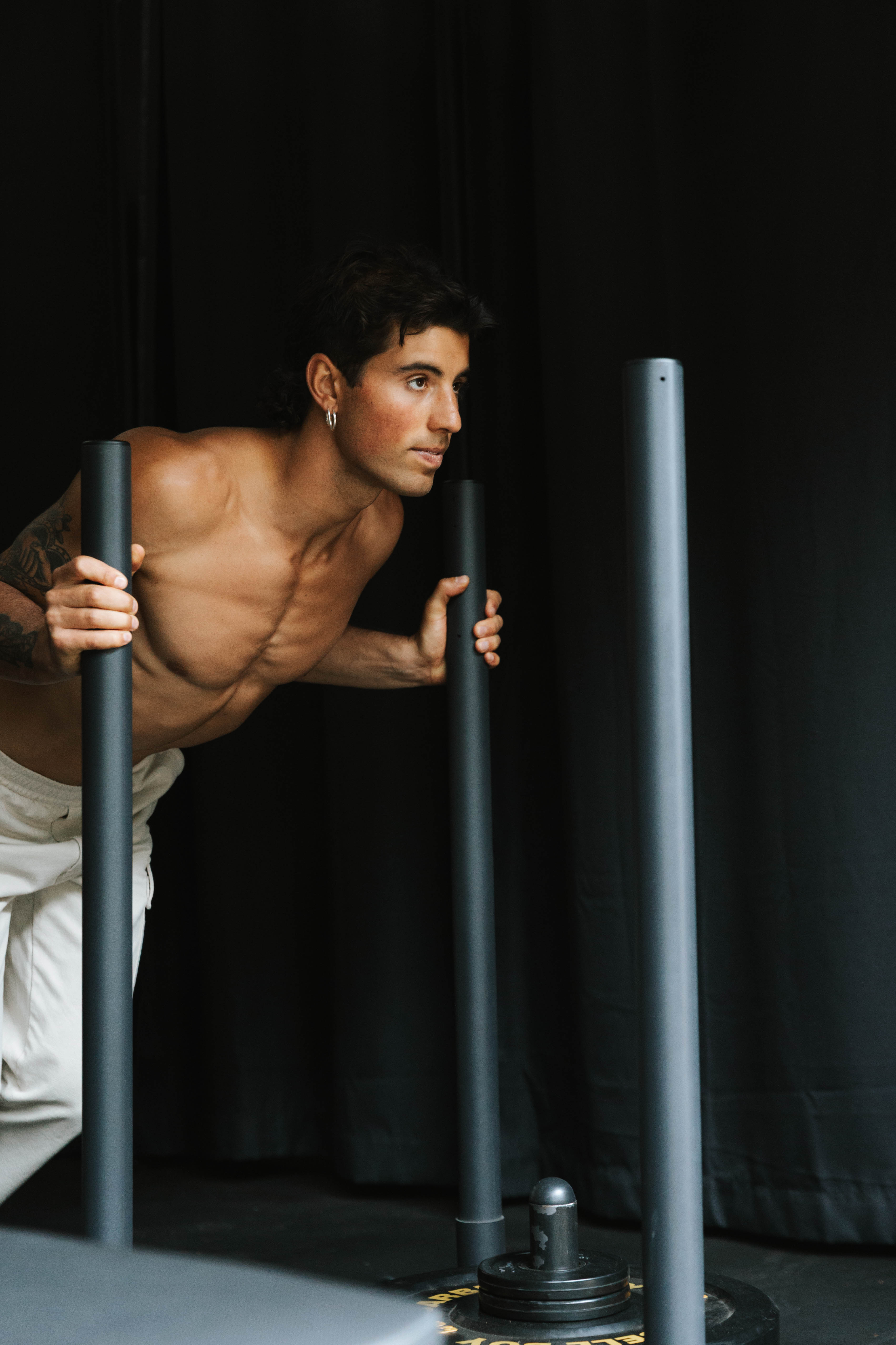Tristan training with intensity against a dark backdrop